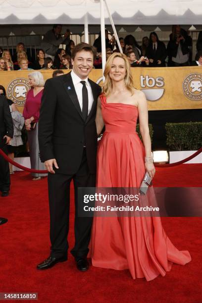 Marc Schauer and Laura Linney attend the 15th annual Screen Actors Guild Awards at the Shrine Auditorium. Linney wears Michael Kors and Cathy...