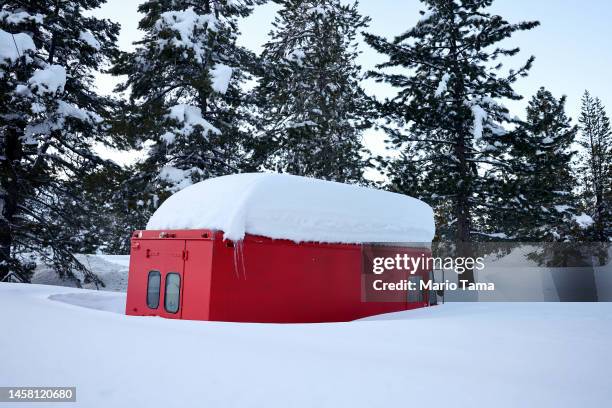 Vehicle is partially buried in snow after a series of atmospheric river storms on January 20, 2023 near South Lake Tahoe, California. California was...