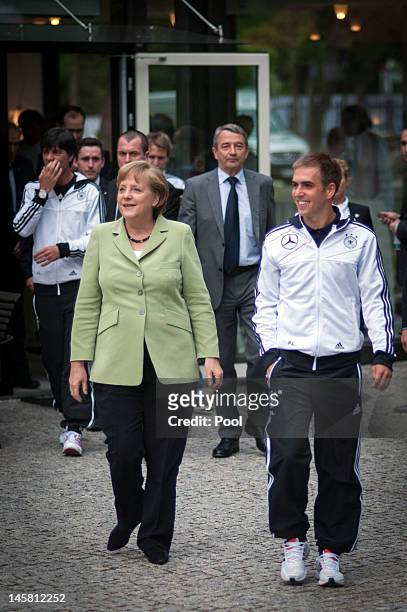 In this photo provided by the German Government Press Office , German Chancellor Angela Merkel and the caption of the German National Team Philipp...