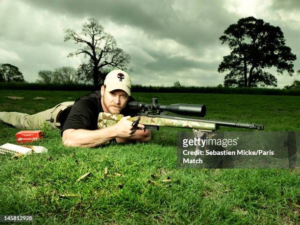 Former Navy SEAL and expert sniper, Chris Kyle, is photographed on his ranch for Paris Match magazine on April 2, 2012 in Dallas, Texas. Published...