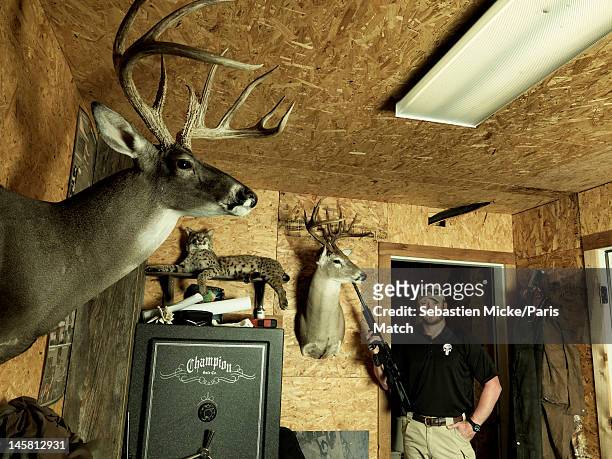 Former Navy SEAL and expert sniper, Chris Kyle, is photographed in a shed on his ranch for Paris Match magazine on April 2, 2012 in Dallas, Texas.