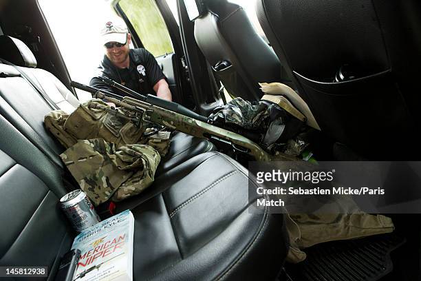 Former Navy SEAL and expert sniper, Chris Kyle, is photographed on his ranch for Paris Match magazine on April 2, 2012 in Dallas, Texas. In this...