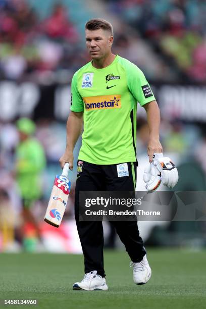 David Warner of the Thunder warms up prior to the Men's Big Bash League match between the Sydney Sixers and the Sydney Thunder at Sydney Cricket...