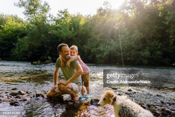 beautiful day spent in nature with my dad - creek stock pictures, royalty-free photos & images