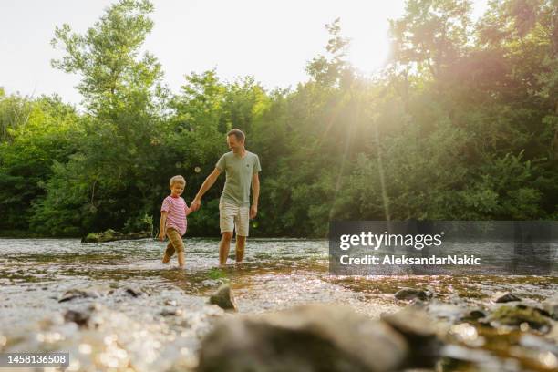 beautiful day spent in nature with my dad - brook stock pictures, royalty-free photos & images