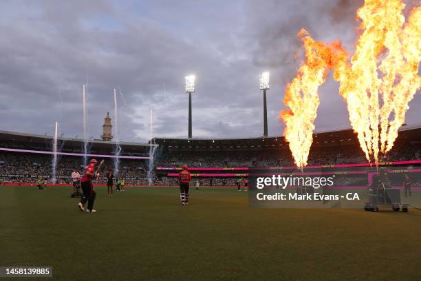 Steve Smith of the Sixers heads out to bat with Josh Philippe of the Sixers during the Men's Big Bash League match between the Sydney Sixers and the...