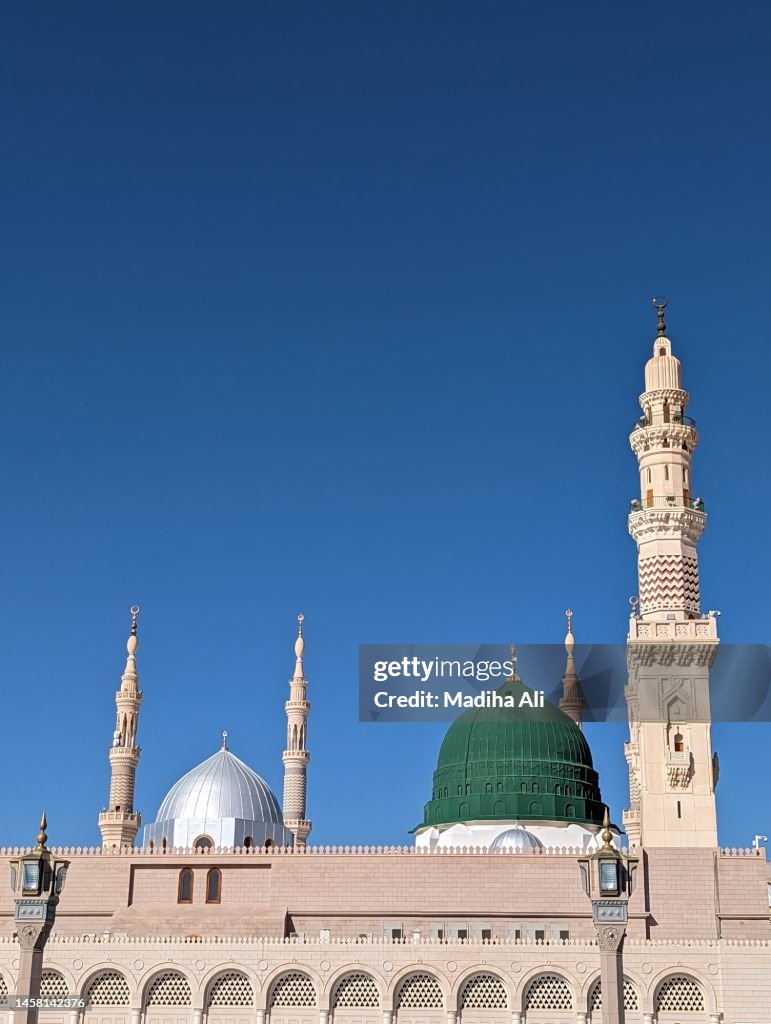 A view of the Green Dome and the Ottoman Turkish style minaret at night in Prophet Mosque in Madinah, also known as Masjid an Nabwi | Arches Architecture Design | Rawdah Rasool, Riyadh ul Jannah | Prophet Muhammad | Saudi Arabia
