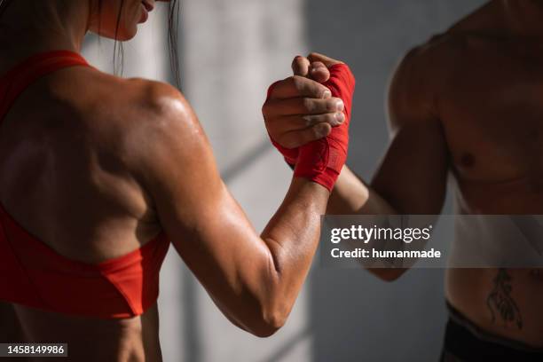 fighter's attitude - muaythai boxing stock pictures, royalty-free photos & images