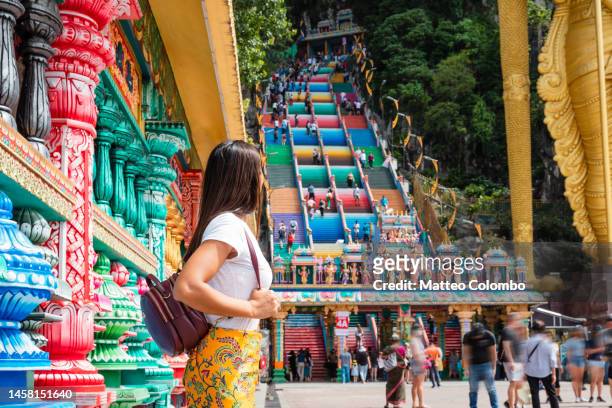 asian woman looking at colorful stairs, malaysia - batu caves stock pictures, royalty-free photos & images
