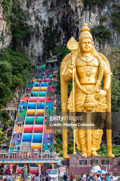 entrance to batu caves with colorful staircase, kuala lumpur - batu caves stock pictures, royalty-free photos & images