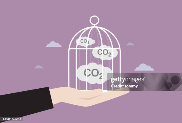 carbon capture by a cage - carbon footprint reduction stock illustrations