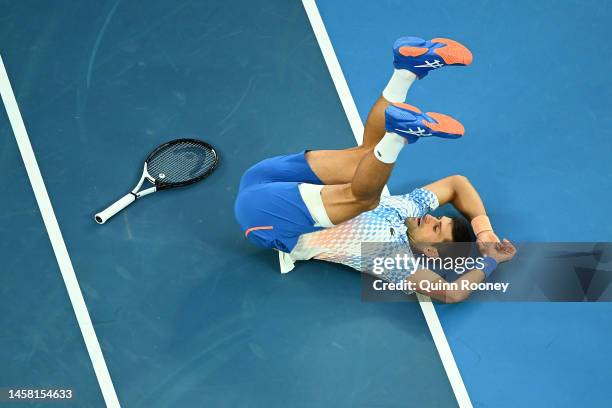 Novak Djokovic of Serbia falls during the third round singles match against Grigor Dimitrov of Bulgaria during day six of the 2023 Australian Open at...