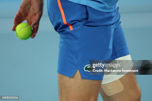 Detailed view of Novak Djokovic of Serbia's strapped leg during the third round singles match against Grigor Dimitrov of Bulgaria during day six of...