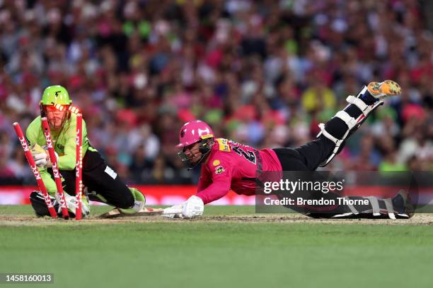 Moises Henriques of the Sixers attempts to get back to his crease during the Men's Big Bash League match between the Sydney Sixers and the Sydney...