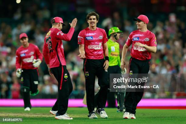 Sean Abbott of the Sixers celebrates the wicket of Matthew Gilkes of the Thunder during the Men's Big Bash League match between the Sydney Sixers and...