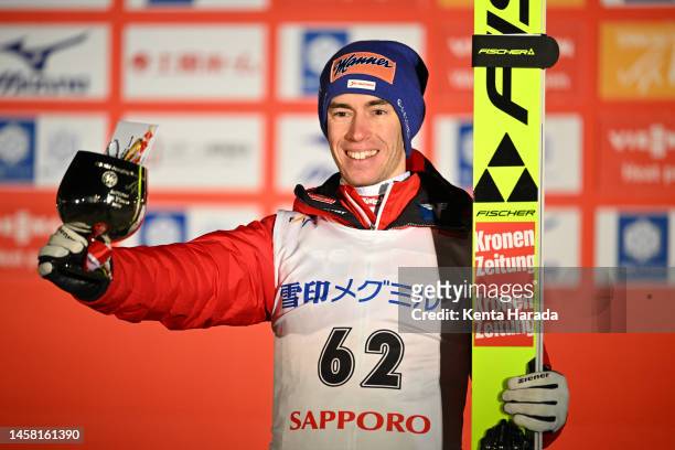 Stefan Kraft of Austria pose on the podium after the men's large hill individual the FIS Ski Jumping World Cup Sapporo at Okurayama Jump Stadium on...