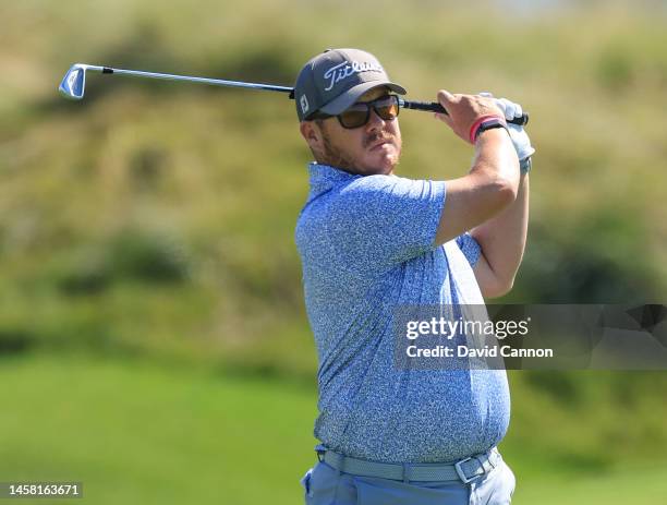 George Coetzee of South Africa plays his second shot on the second hole during the third round on day three of the Abu Dhabi HSBC Championship at Yas...