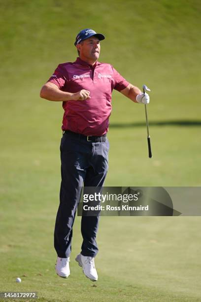 Padraig Harrington of Ireland jumps to look at the eighteenth green during day three of the Abu Dhabi HSBC Championship at Yas Links Golf Course on...