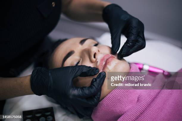 permanent lips make up. - lip tattooing stock pictures, royalty-free photos & images