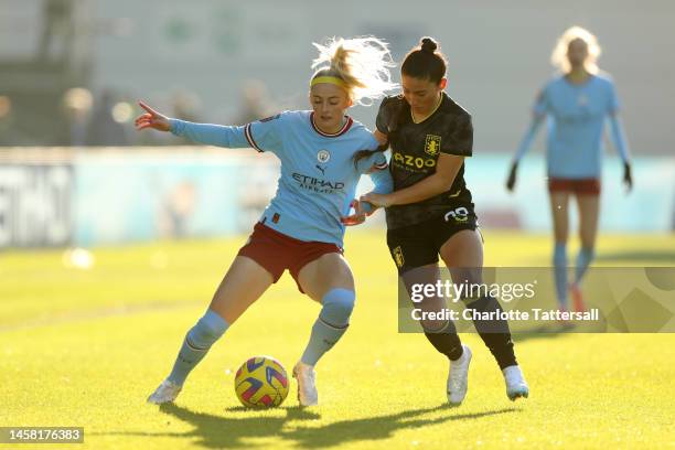 Chloe Kelly of Manchester City is challenged by Maz Pacheco of Aston Villa during the FA Women's Super League match between Manchester City and Aston...