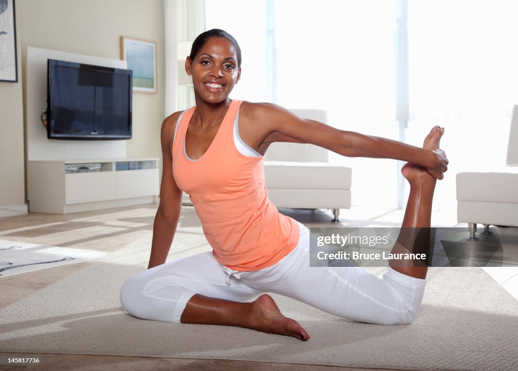 African American woman exercising at home