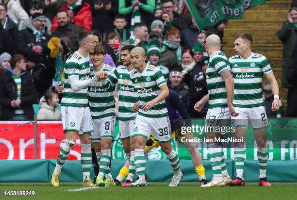 Kyogo Furuhashi of Celtic celebrates with teammates after scoring the team's second goal during the Scottish Cup Fourth Round match between Celtic...