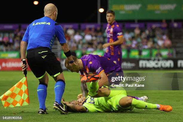 Jack Clisby of the Glory retaliates after being kicked by Vduring the round 13 A-League Men's match between Perth Glory and Melbourne Victory at...