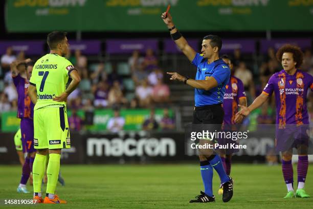Referee Stephen Lucas shoes the red card to Chris Ikonomidis of the Victory after an altercation with Jack Clisby of the Glory during the round 13...