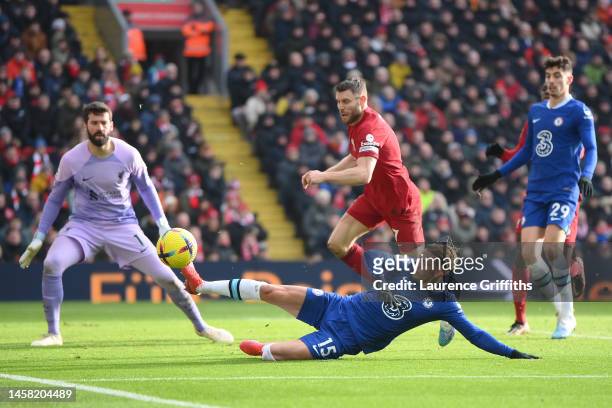Mykhailo Mudryk of Chelsea slides fro the ball from James Milner of Liverpool during the Premier League match between Liverpool FC and Chelsea FC at...