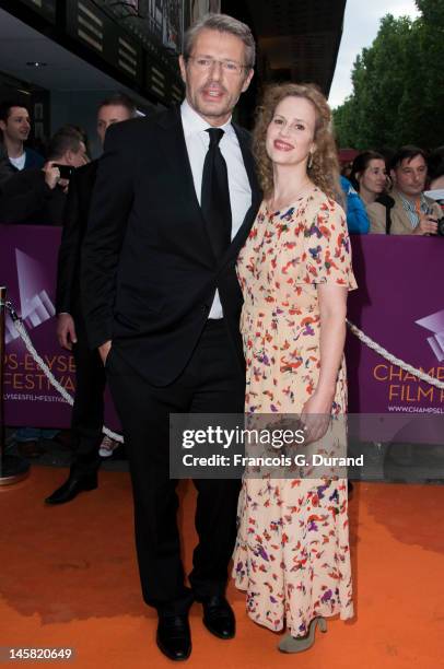 Lambert Wilson and Florence Darel arrive to the Champs-Elysees Film Festival at Cinema Gaumont Marignan on June 6, 2012 in Paris, France.