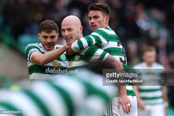Aaron Mooy of Celtic celebrates with teammates after scoring the team's fifth goal during the Scottish Cup Fourth Round match between Celtic and...