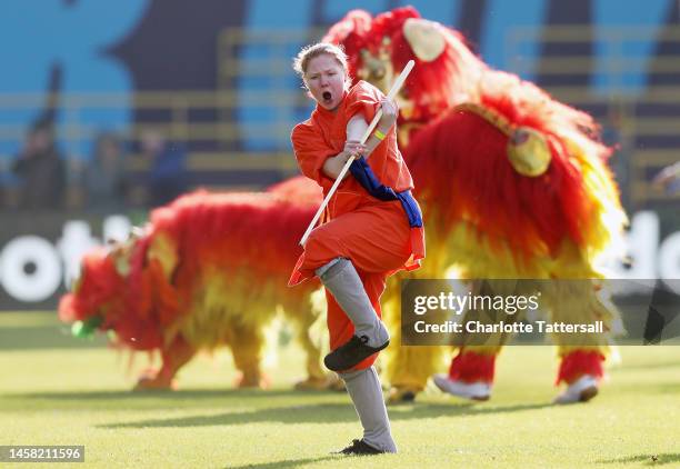 Performers take part in a performance in celebration of the upcoming Chinese New Year, the Year of the Rabbit during the FA Women's Super League...