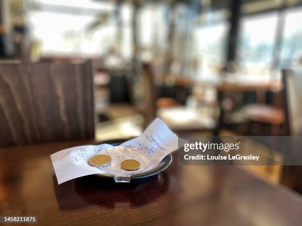 restaurant bill on a table - invoice stock pictures, royalty-free photos & images