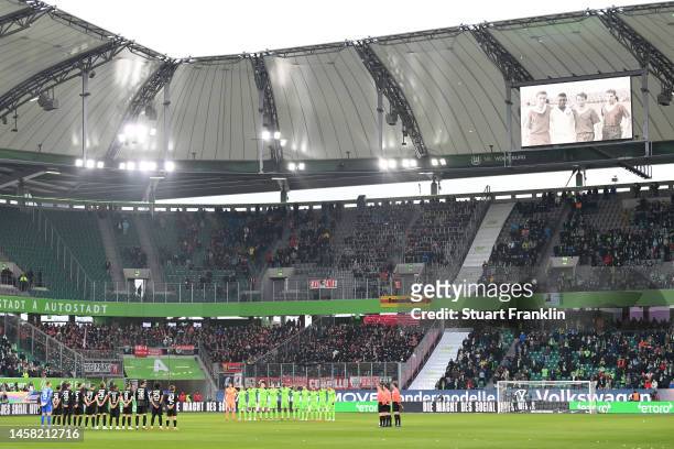 General view as players of VfL Wolfsburg and SC Freiburg hold a minutes silence in memory of former Brazil player Pele prior to during the Bundesliga...