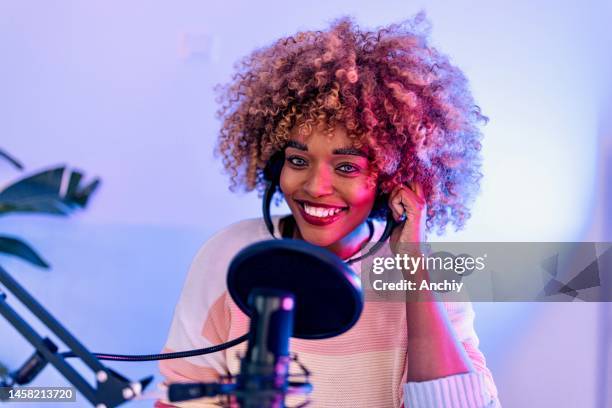 close up of a woman recording podcast - television host stock pictures, royalty-free photos & images