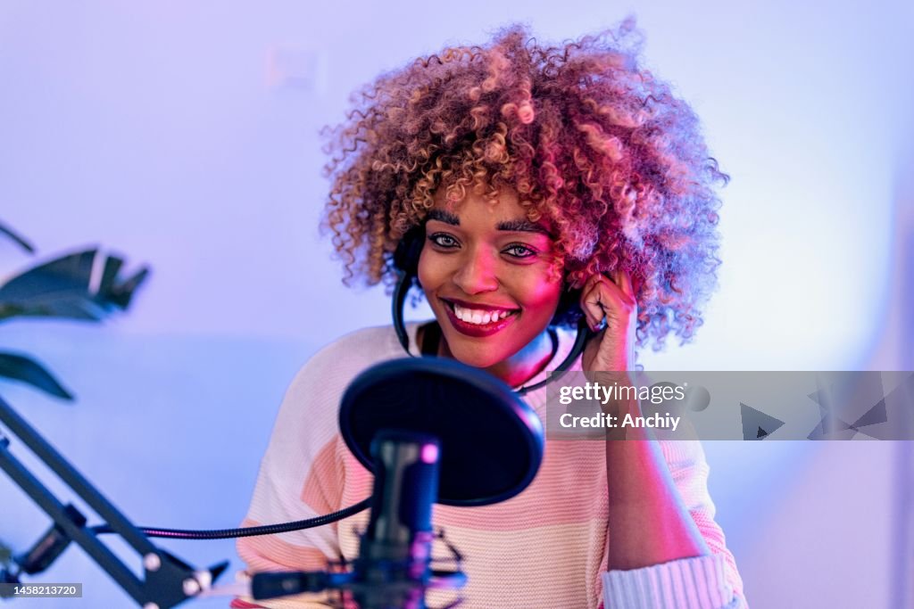 Close up of a woman recording podcast
