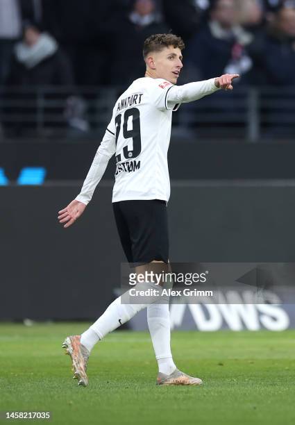 Jesper Lindstrom of Eintracht Frankfurt celebrates after scoring the team's first goal with teammates during the Bundesliga match between Eintracht...