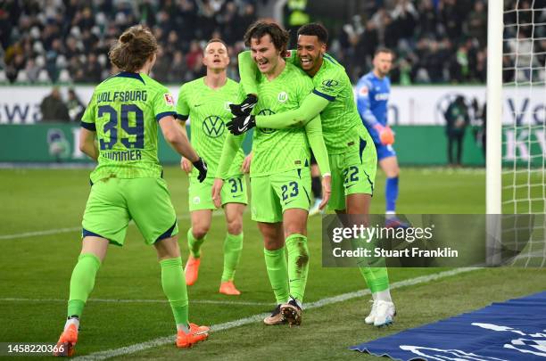 Jonas Wind of VfL Wolfsburg celebrates after scoring the team's second goal with teammates during the Bundesliga match between VfL Wolfsburg and...