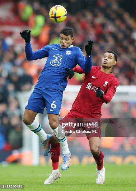 Thiago Silva of Chelsea jumps for the ball with Cody Gakpo of Liverpool during the Premier League match between Liverpool FC and Chelsea FC at...