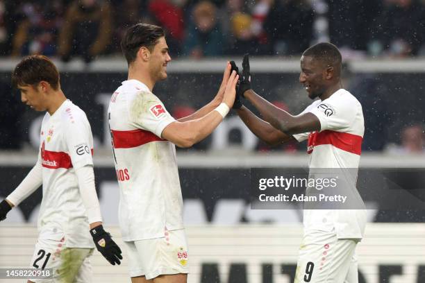 Sehrou Guirassy of VfB Stuttgart celebrates after scoring the team's first goal with teammate Konstantinos Mavropano during the Bundesliga match...