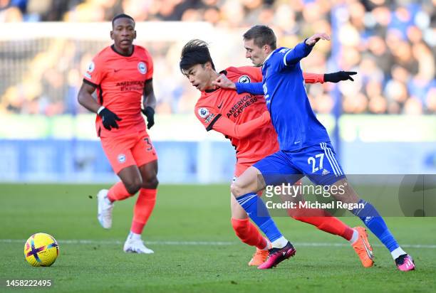Timothy Castagne of Leicester City battles for possession with Kaoru Mitoma of Brighton & Hove Albion during the Premier League match between...