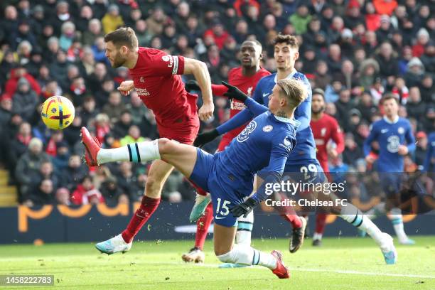 Mykhaylo Mudryk of Chelsea is challenged by James Milner of Liverpool during the Premier League match between Liverpool FC and Chelsea FC at Anfield...