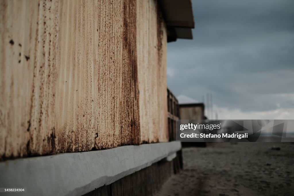Shack with rusty iron facade on the sea