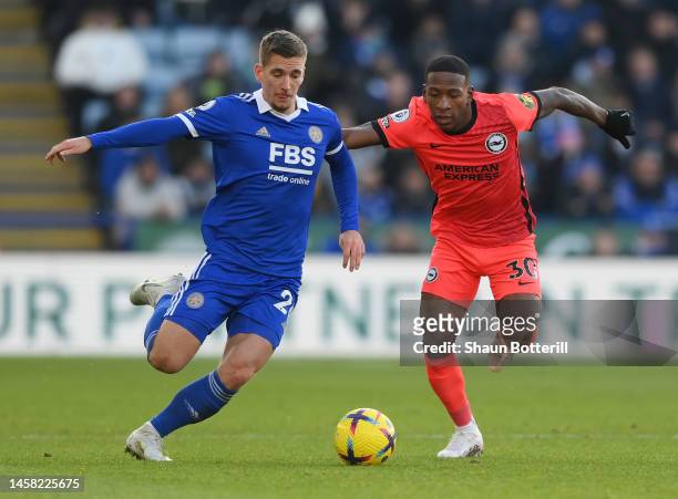 Dennis Praet of Leicester City battles for possession with Pervis Estupinan of Brighton & Hove Albion during the Premier League match between...