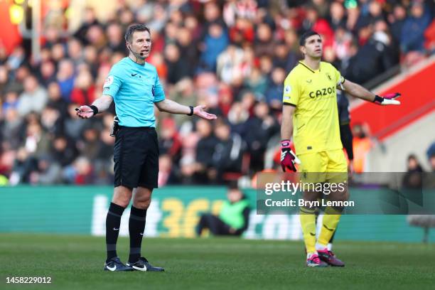 Referee Michael Salisbury reacts as the game is paused due to a drone flying above the pitch during the Premier League match between Southampton FC...