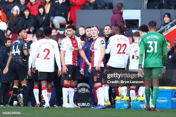 Players react after the game is paused due to a drone above the pitch during the Premier League match between Southampton FC and Aston Villa at...