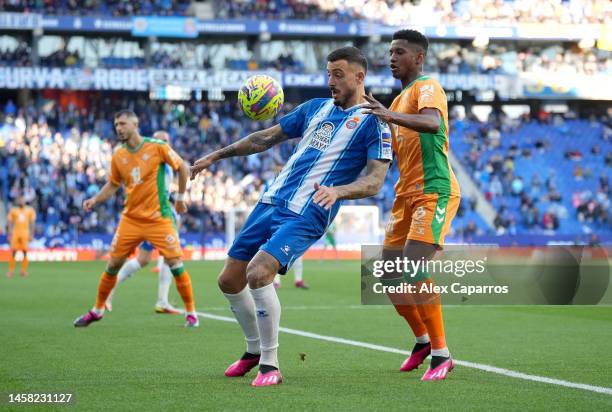 Joselu of RCD Espanyol controls the ball whilst under pressure from Abner Vinicius of Real Betis during the LaLiga Santander match between RCD...