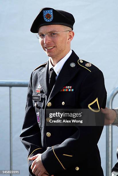 Army Private Bradley Manning is escorted as he leaves a military court at the end of the first of a three-day motion hearing June 6, 2012 in Fort...