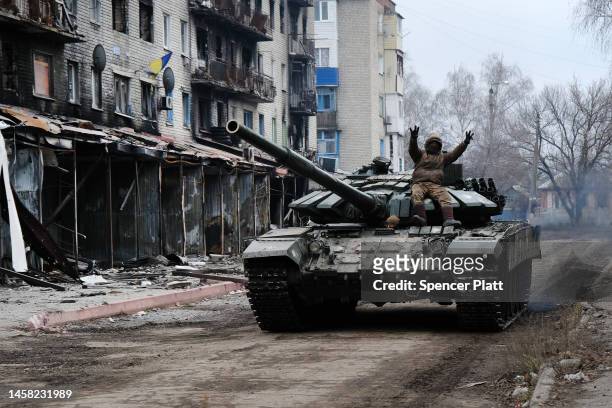Ukrainian tank drives down a street in the heavily damaged town of Siversk which is situated near the front lines with Russia on January 21, 2023 in...