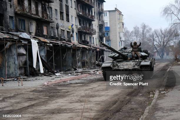 Ukrainian tank drives down a street in the heavily damaged town of Siversk which is situated near the front lines with Russia on January 21, 2023 in...